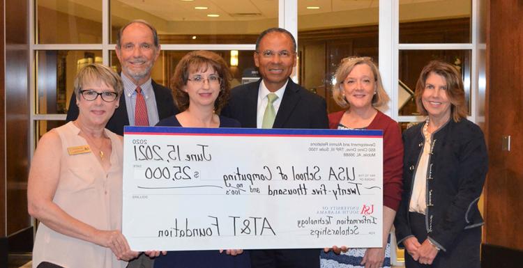 The AT&T Foundation donates $25,000 for the AT&T Aspiring Leaders in Information Technology scholarships. From left; Margaret M. Sullivan, V.P. Development & Alumni Relations; Lori Harris, development officer, School of Computing; Glyn Agnew, regional director, AT&T Alabama; Angela Clark, chair, department of Information Systems & Technology; Dr. Alec Yasinsac, dean, School of Computing; Melissa Smith, senior instructor & recruiting coordinator, department of Information Systems & Technology.