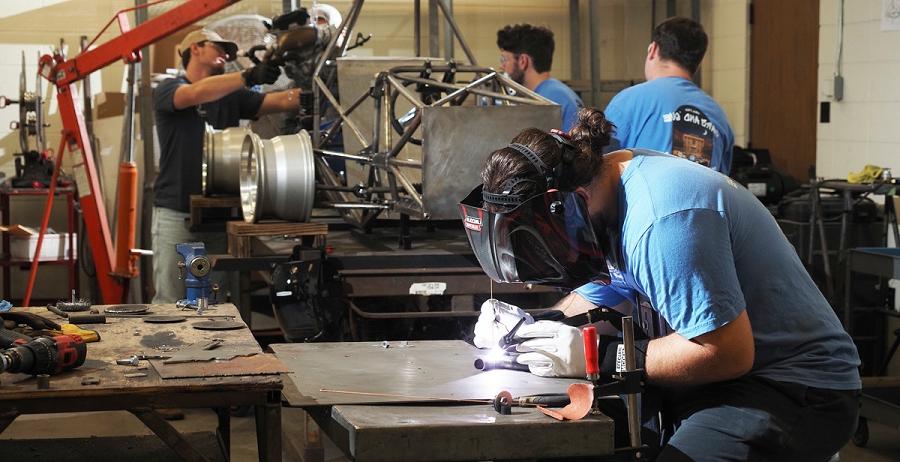 Nick Long, welding in the Science Laboratory Building at the University of South Alabama, is joined by other student members of South's chapter of the Society of Automotive Engineers last semester in building a hybrid vehicle to compete at the SAE Formula Hybrid Competition at the New Hampshire Motor Speedway.